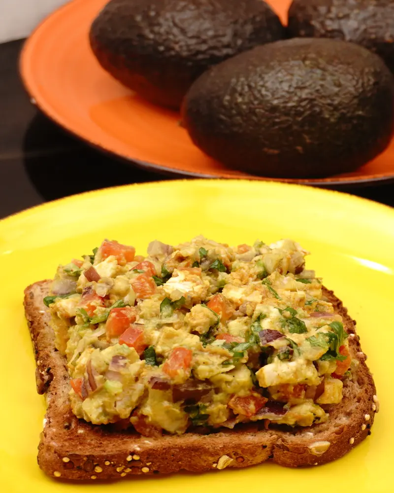 Avocado Chicken Open Sandwich - close up view of finished dish plated and garnished