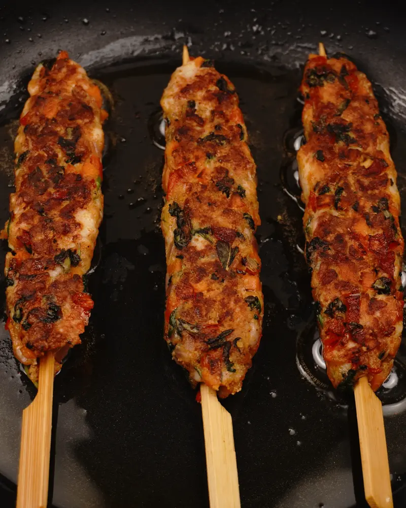  Veggie Loaded Chicken seekh kebab - close up view of finished dish plated and garnished