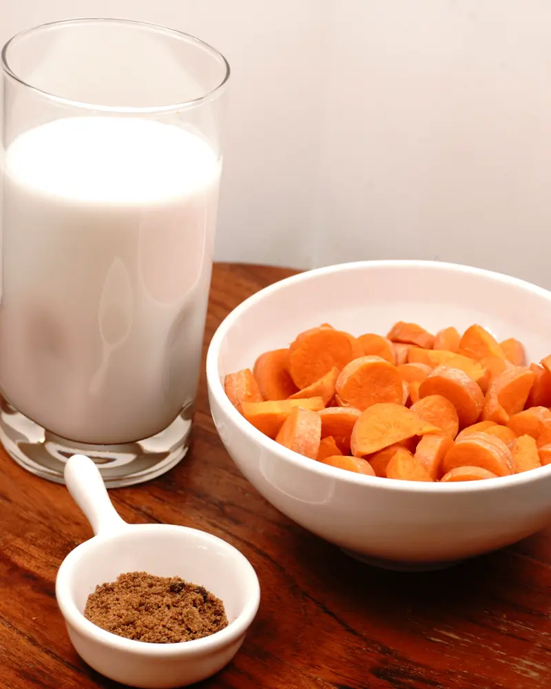 Ingredients for Coconut Milk Carrot Smoothie including Small pieces of carrot, Thick coconut milk, Jaggery powder