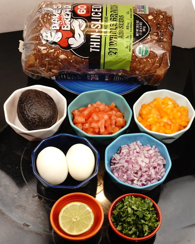 Ingredients for Avocado Egg Veggie Salad Open Sandwich including Whole grain bread, Hard boiled egg, Hash avocado
