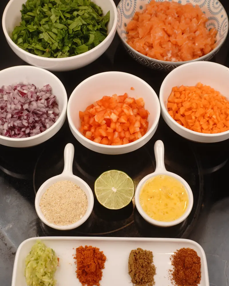 Ingredients for Veggie Loaded Fish Seekh Kebab including Fish pieces, Carrot, Spinach, coriander and pudina leaves