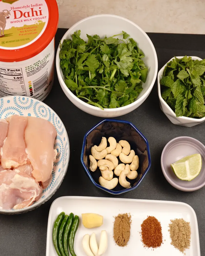 Ingredients for Hariyali Murgh Tikka including Boneless skinless chicken thigh pieces, Coriander leaves, Mint leaves