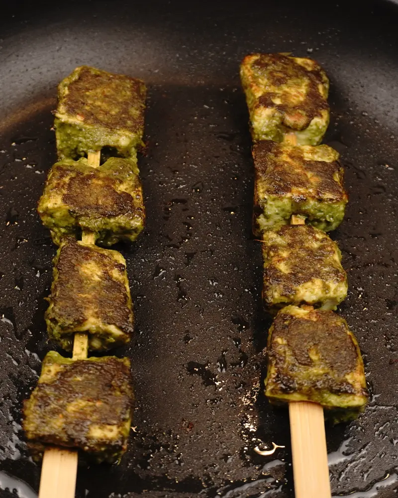 Low Carb, Less Oil Hariyali Tikka  - close up view of finished dish plated and garnished