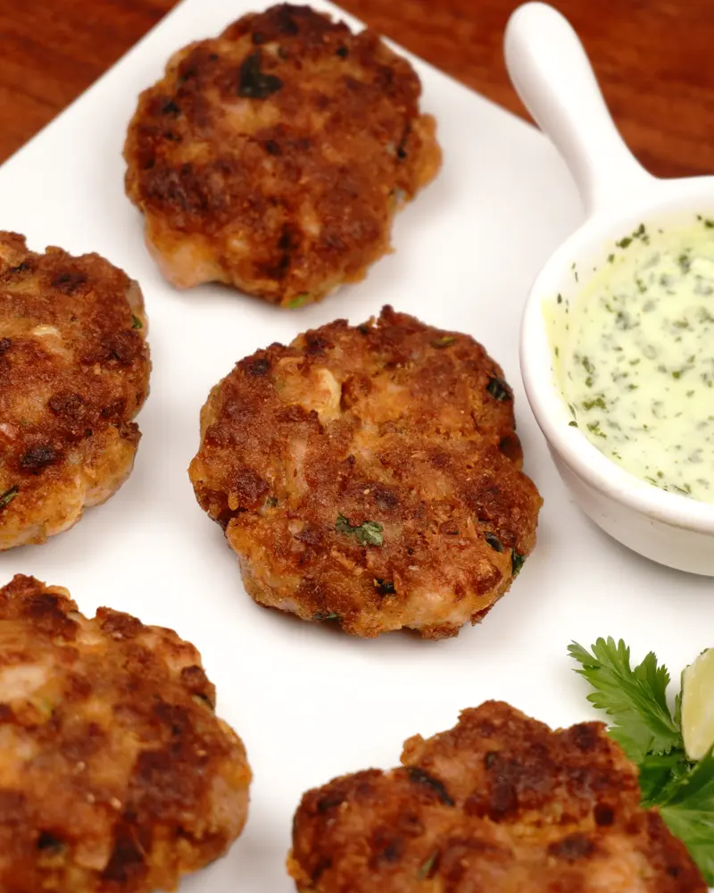 Less Prep Time -15 Mins Chicken Patty Kebab                - close up view of finished dish plated and garnished