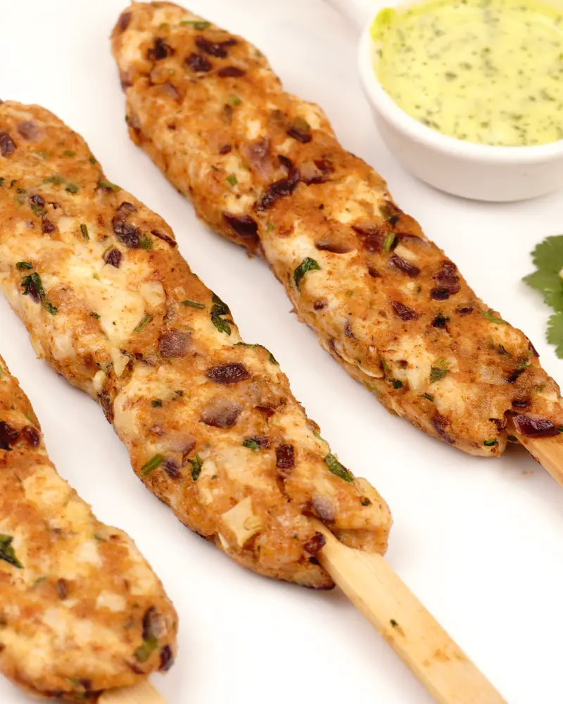 Low Calorie Chicken Seekh Kebab - close up view of finished dish plated and garnished