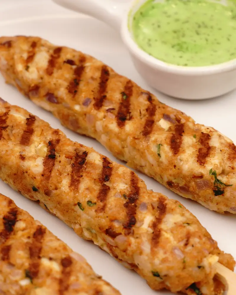 Low Calorie Pan Grilled Chicken Seekh Kebab - close up view of finished dish plated and garnished
