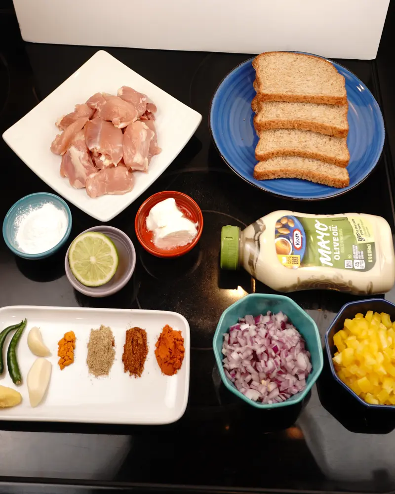 Ingredients for Mayo Chicken Tikka Sandwich including Boneless skinless chicken thighs, Whole milk thick curd, Chili powder