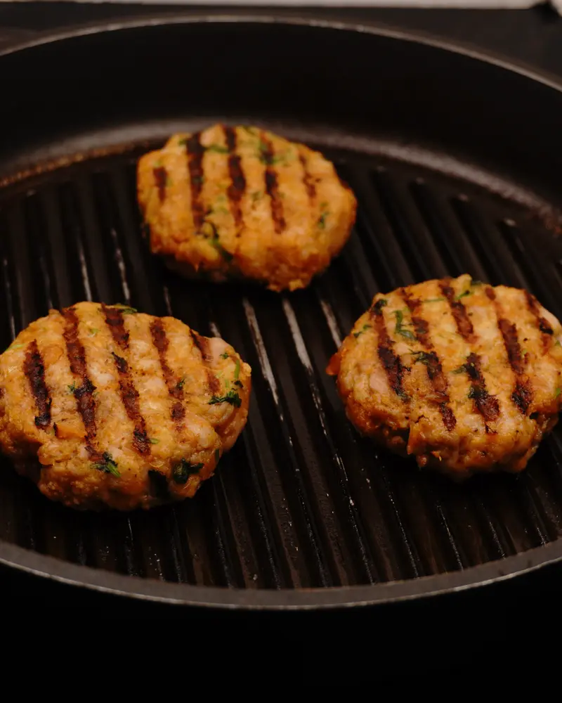 Perfect Pan-Grilled Chicken patty Kebab – Restaurant Style at Home - close up view of finished dish plated and garnished