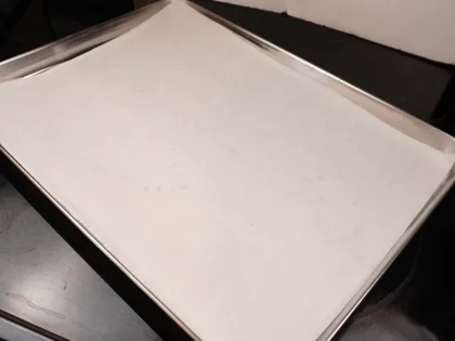 Bread Crumbs - Cover the large baking tray with sheet of parchment paper and spread the prepared fresh bread crumbs on paper