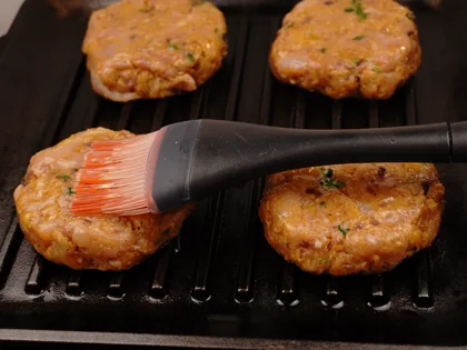 broiled chicken patty kebab - Oil the preheated Pan, place chicken patties and apply ghee