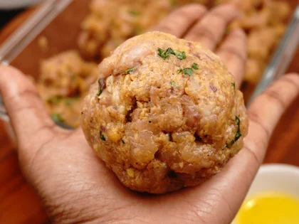Apply oil on your hands, take one portion of chicken mixture to form a loosely packed ball then lightly flatten the ball at the top to form circular shape chicken patty 