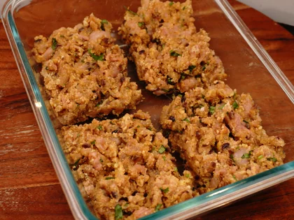 Take the chicken mixture from the refrigerator and roughly divide them in to equal size portions