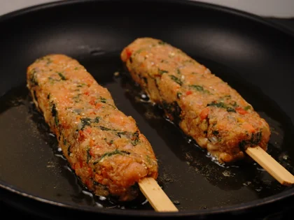 Veggie Loaded Fish Seekh Kebab - Cook the skewers first side untill form brown/dark brown crust over medium flame