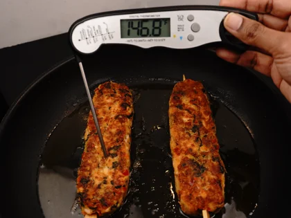 Flip the fish skewers on second side, reduce the heat to medium-low, until form brown/dark brown crust