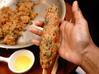 Veggie Loaded Fish Seekh Kebab - Skewer the fish mixture