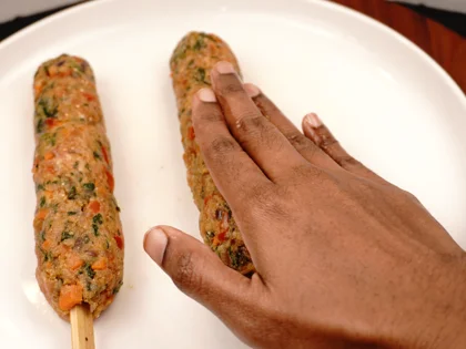 Veggie Loaded Fish Seekh Kebab - Gently roll and flatten the mixture on the skewers