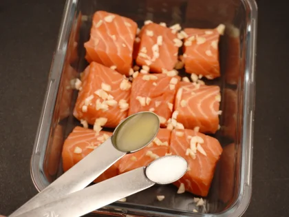Garlic Fish Tikka (Lasooni Fish Tikka) - Coat the fish pieces and keep aside