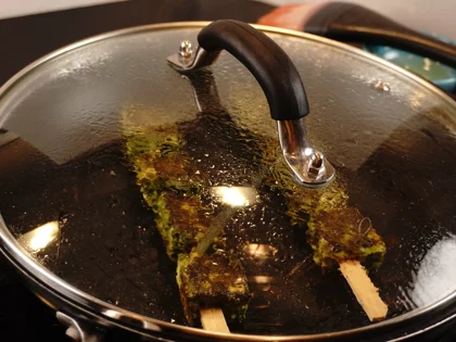 Reduce the heat to low, close pan with lid, continue to cook them for about 2 to 3 minutes