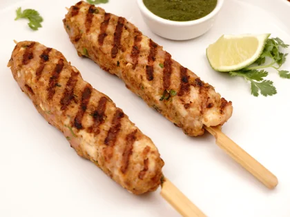 Now the pan grilled chicken seekh kebab is ready to be served with curd mint dip       