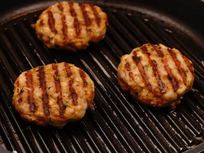 Just before flip them, baste ghee on top side of the chicken patties then flip them & reduce the heat to low  