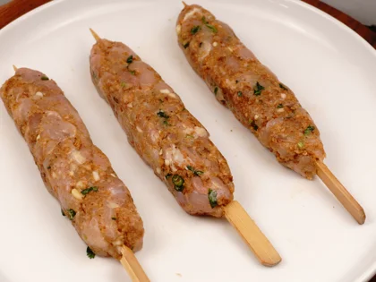 Less Prep time -15 Mins Pan Grilled Chicken Seekh Kebab                - Gently roll and flatten the mixture on the skewers