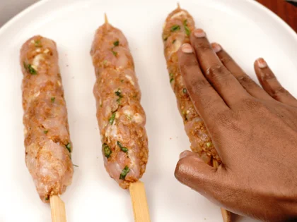 Less Prep time -15 Mins Pan Grilled Chicken Seekh Kebab                - Gently roll and flatten the mixture on the skewers