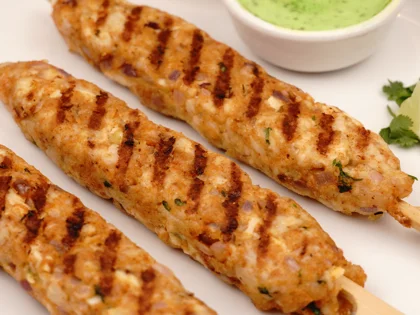 Now the pan grilled chicken seekh kebab is ready to be served with curd mint dip       