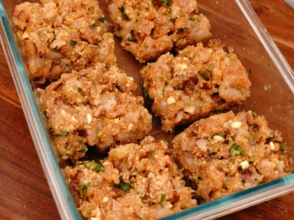 Take the chicken mixture from the refrigerator and roughly divide them in to equal size portions