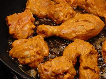 Mughlai Chicken Curry - Brown the chicken pieces-( First side)