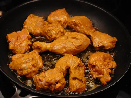 Mughlai Chicken Curry - Brown the chicken pieces-( First side)