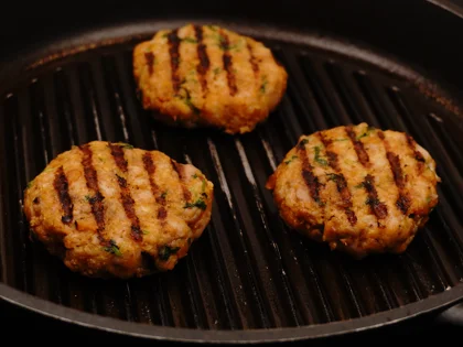 Just before flip them, baste ghee on top side of the chicken patties then flip them & reduce the heat to low  