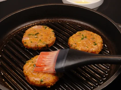 Just before flip them, baste ghee on top side of the chicken patties then flip them & reduce the heat to low  