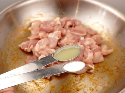 Sprinkle salt & lime juice over the chicken pieces then gently stir with the ladle, to remove the masala bits stuck with the bottom of the pan