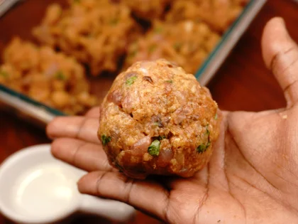 Apply oil on your hands, take one portion of chicken mixture to form a loosely packed ball then lightly flatten the ball at the top to form circular shape chicken patty 