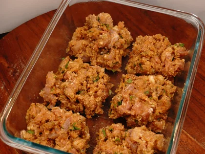 Take the chicken mixture from the refrigerator and roughly divide them in to equal size portions