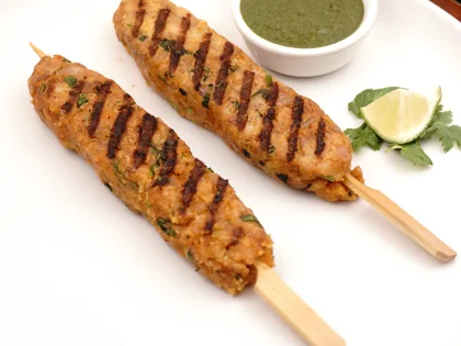 Now the pan grilled chicken seekh kebab is ready to be served with curd mint dip               